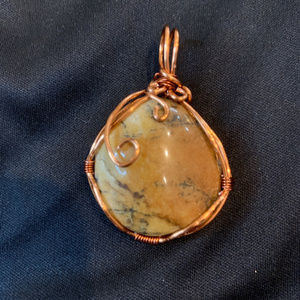 Beautiful river stone wrapped on copper wire